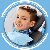 boy in dentist chair smiling