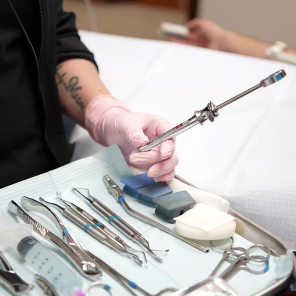 dental hygienist holding a tool